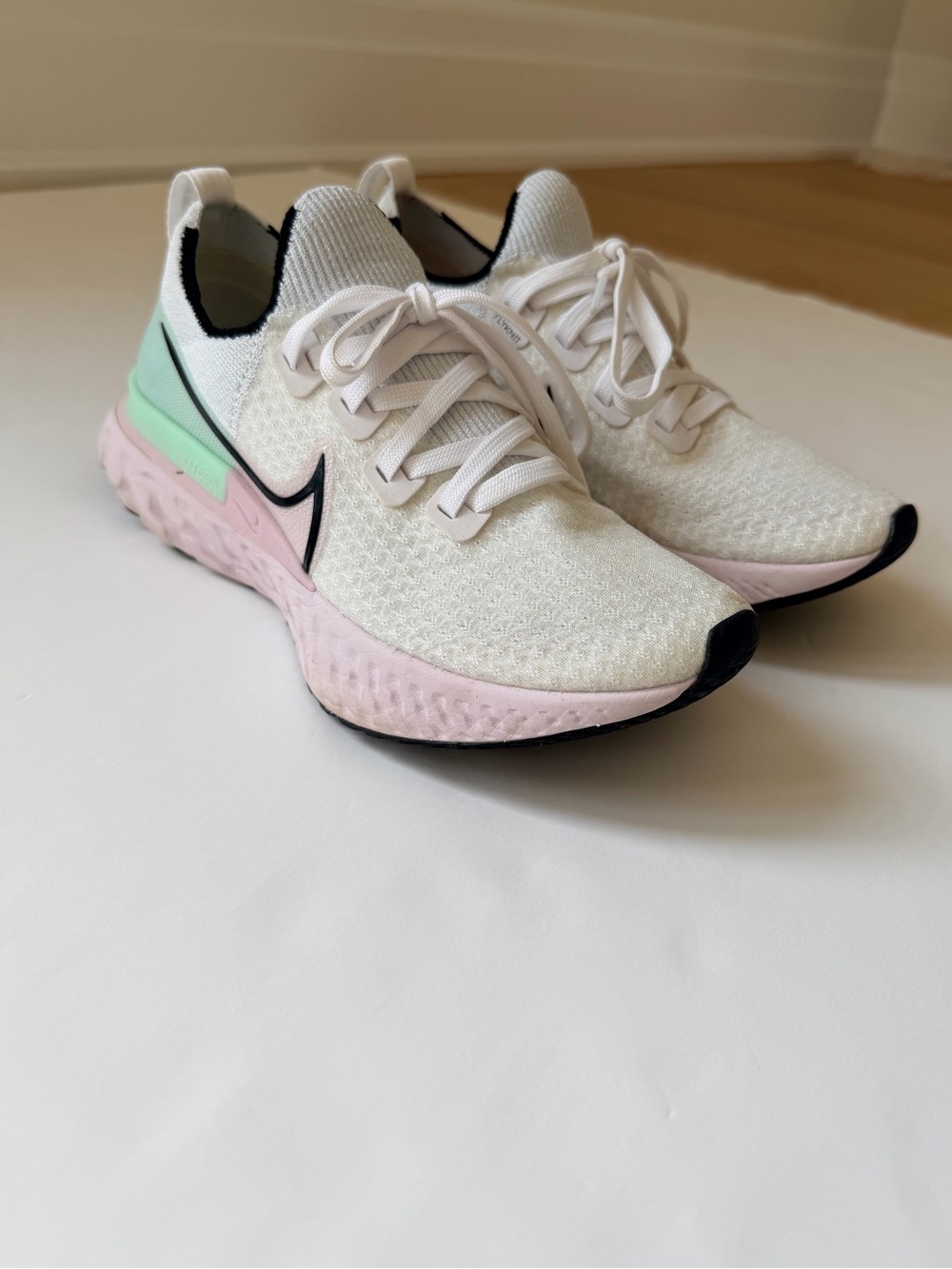 Nike Women's React Infinity Run Flyknit Running Shoe in White Iced Lilac